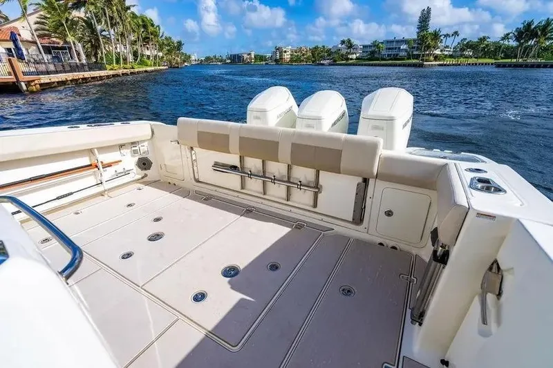  Yacht Photos Pics 2022 Boston Whaler 420 Outrage boat deck with scenic waterfront view.