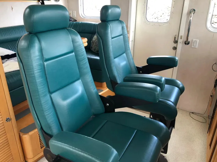 Evening Star Yacht Photos Pics Luxurious teal seating inside a 2003 Cape Horn Trawler yacht cabin.