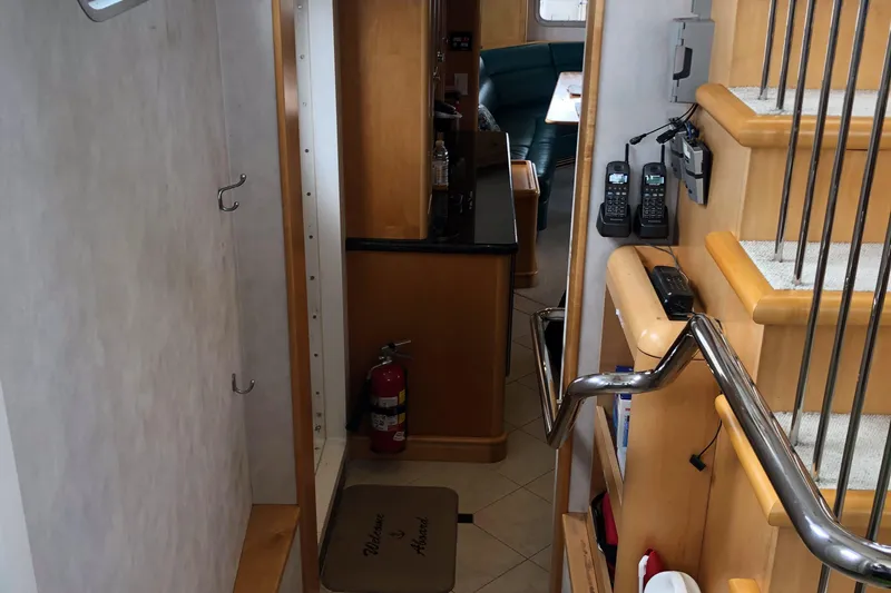 Evening Star Yacht Photos Pics Interior of 2003 Cape Horn Trawler with stairs, fire extinguisher, and communication devices.