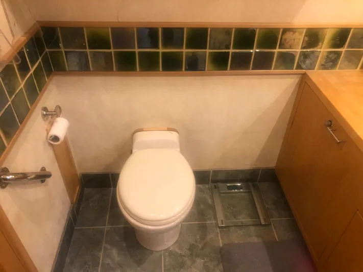 Evening Star Yacht Photos Pics 2003 Cape Horn Trawler bathroom with tiled walls and modern fixtures.