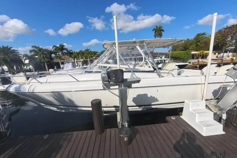  Yacht Photos Pics 2005 Intrepid 348 Walkaround boat docked under a clear blue sky.