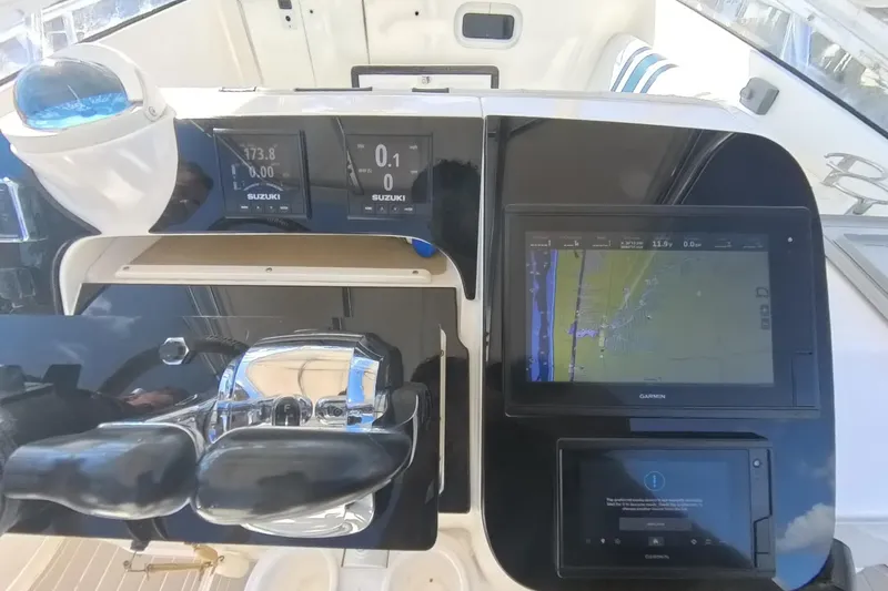  Yacht Photos Pics Control panel of a 2005 Intrepid 348 Walkaround boat with navigation screens.