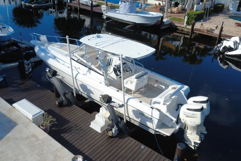  Yacht Photos Pics 2005 Intrepid 348 Walkaround boat docked with Suzuki engines, viewed from above.
