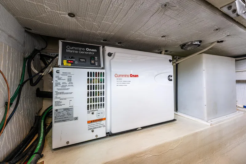 Big Blue Yacht Photos Pics Cummins Onan marine generator in 2010 Back Cove 37 boat engine room.