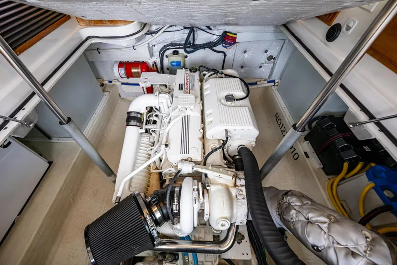 Big Blue Yacht Photos Pics Engine compartment of a 2010 Back Cove 37 boat, featuring a clean, organized layout.