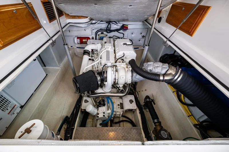 Big Blue Yacht Photos Pics Engine compartment of a 2010 Back Cove 37 boat, showcasing detailed mechanical components.