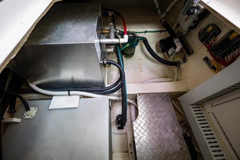 Big Blue Yacht Photos Pics Engine compartment of a 2010 Back Cove 37 boat, featuring mechanical components and wiring.