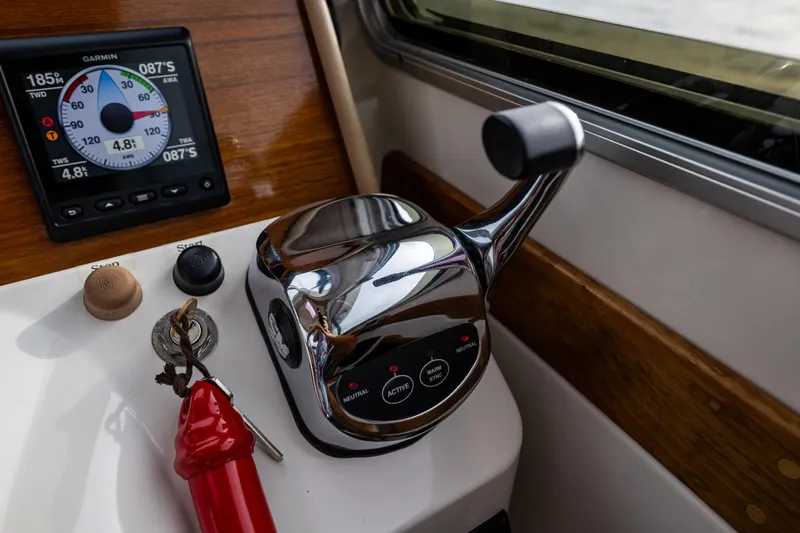 Big Blue Yacht Photos Pics Control panel of a 2010 Back Cove 37 boat with throttle and navigation display.