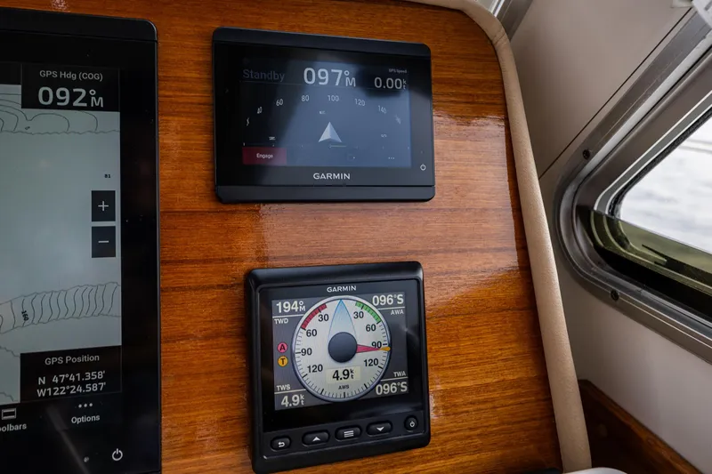 Big Blue Yacht Photos Pics Garmin navigation displays on 2010 Back Cove 37 boat dashboard, showing GPS and speed data.