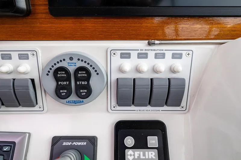 Big Blue Yacht Photos Pics Control panel of a 2010 Back Cove 37 boat with various switches and dials.