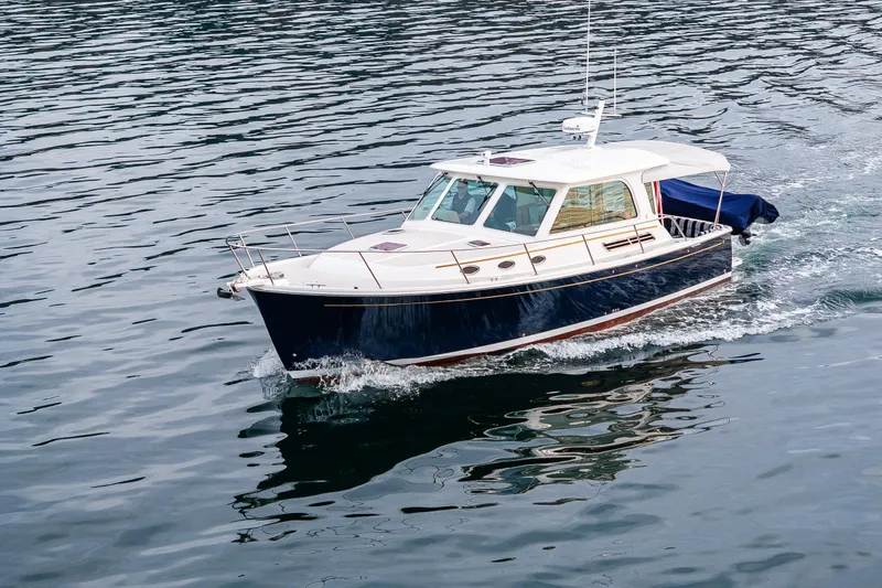 Big Blue Yacht Photos Pics 2010 Back Cove 37 boat cruising on calm water.