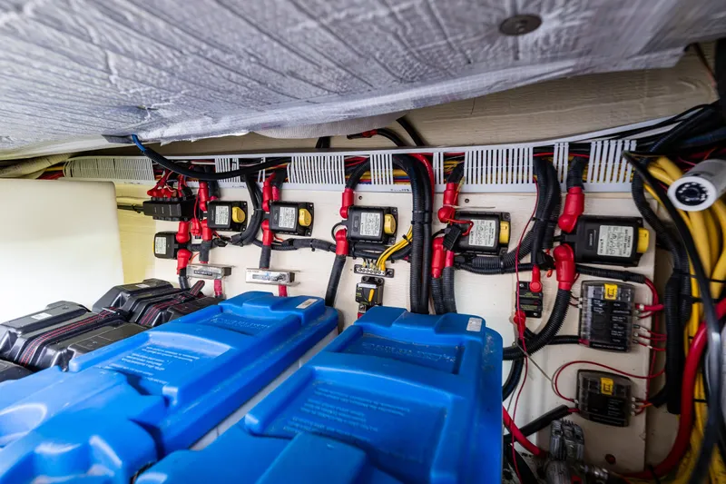 Big Blue Yacht Photos Pics Electrical system of a 2010 Back Cove 37 boat, featuring batteries and wiring.