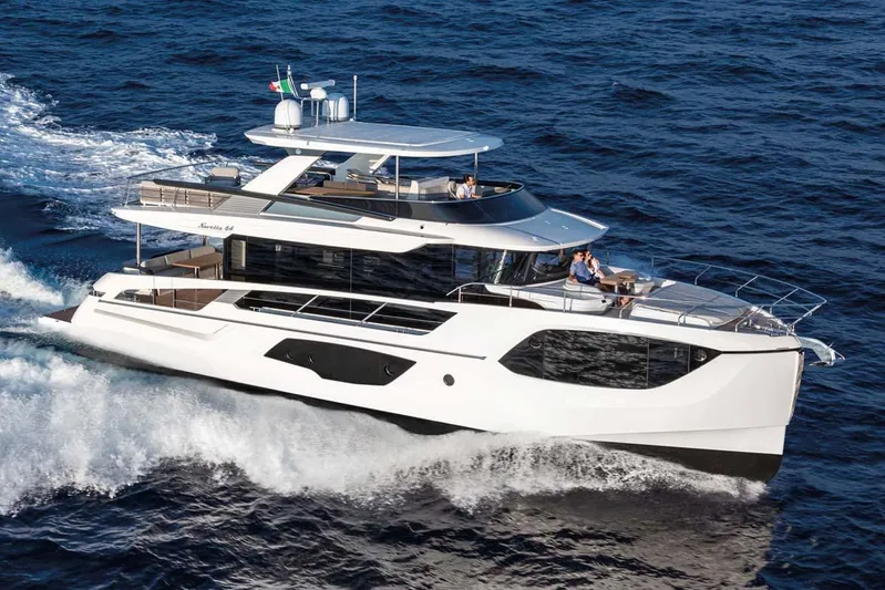  Yacht Photos Pics Manufacturer Provided Image: 2022 Absolute 64 Navetta luxury yacht cruising on open water.