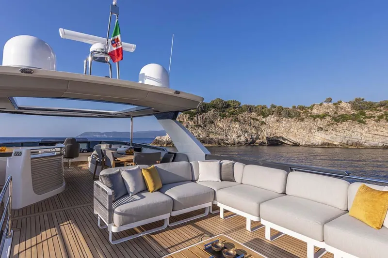  Yacht Photos Pics Manufacturer Provided Image: Luxury deck of 2022 Absolute 64 Navetta yacht with scenic coastal view.