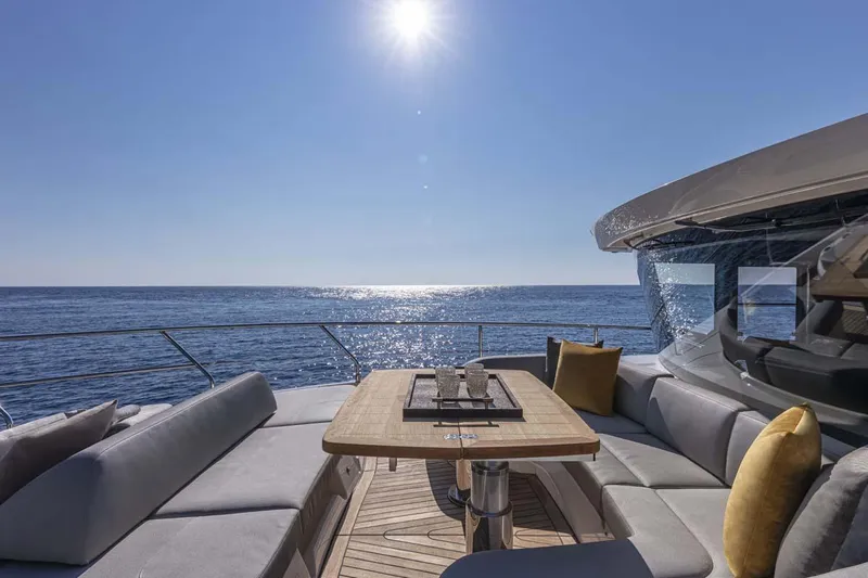  Yacht Photos Pics Manufacturer Provided Image: Luxurious deck seating on the 2022 Absolute 64 Navetta yacht with ocean view.