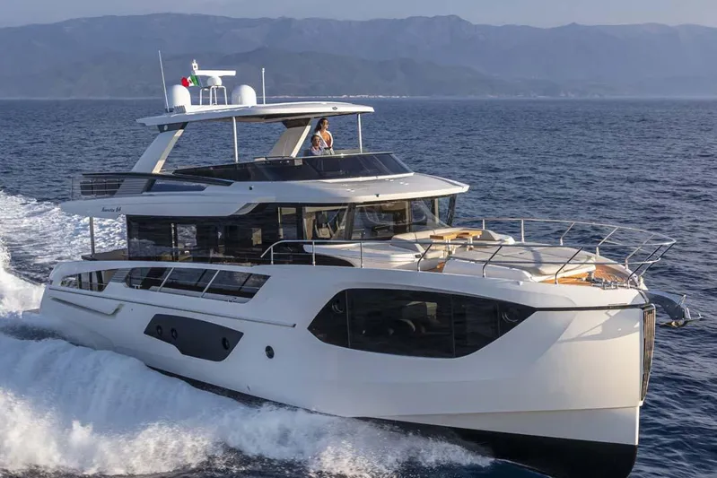  Yacht Photos Pics Manufacturer Provided Image: 2022 Absolute 64 Navetta luxury yacht cruising on the ocean.