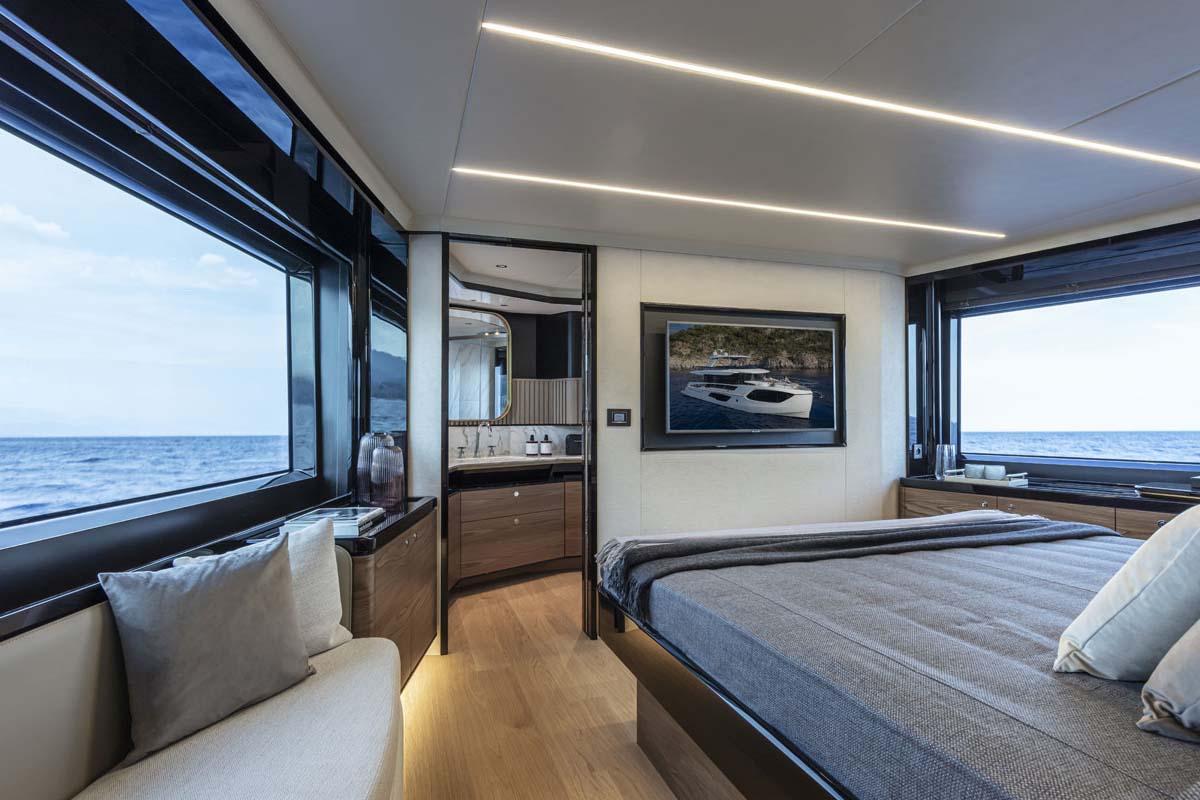 Manufacturer Provided Image: Luxurious bedroom interior of 2022 Absolute 64 Navetta yacht with ocean view.