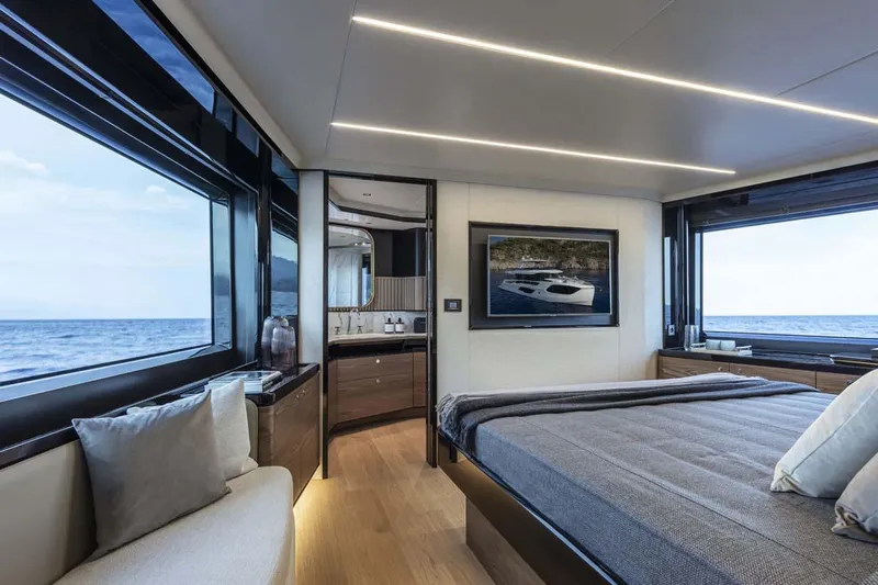  Yacht Photos Pics Manufacturer Provided Image: Luxurious bedroom interior of 2022 Absolute 64 Navetta yacht with ocean view.