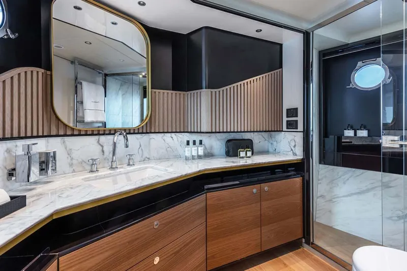  Yacht Photos Pics Manufacturer Provided Image: Luxurious bathroom in 2022 Absolute 64 Navetta yacht with marble countertop and modern fixtures.