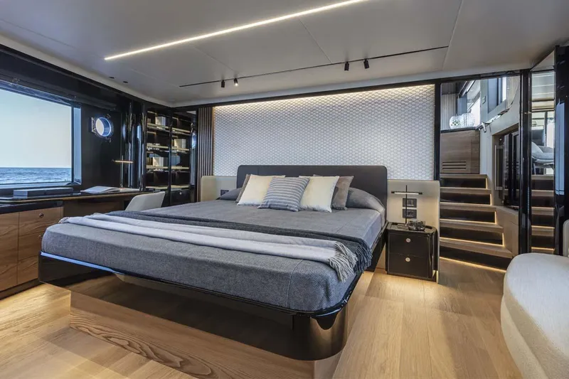  Yacht Photos Pics Manufacturer Provided Image: Luxurious master bedroom on the 2022 Absolute 64 Navetta yacht with modern decor and ocean view.