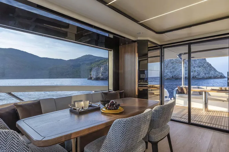  Yacht Photos Pics Manufacturer Provided Image: Luxurious interior of 2022 Absolute 64 Navetta yacht with scenic ocean view.