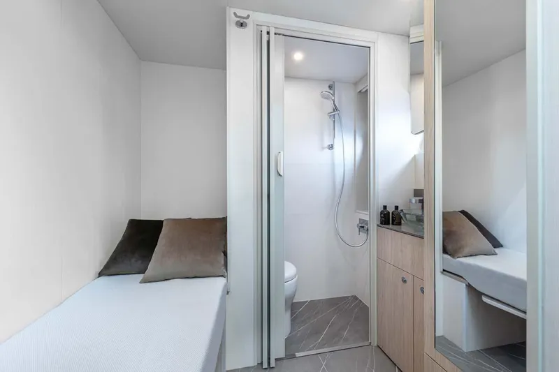  Yacht Photos Pics Manufacturer Provided Image: Modern bathroom and seating area in 2022 Absolute 64 Navetta yacht.