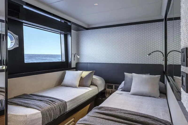  Yacht Photos Pics Manufacturer Provided Image: Luxurious twin bedroom on the 2022 Absolute 64 Navetta yacht with ocean view.