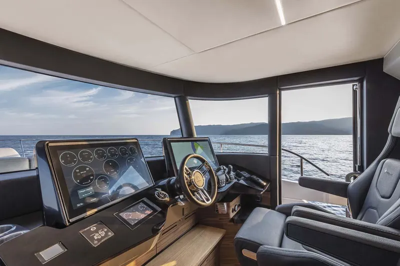  Yacht Photos Pics Manufacturer Provided Image: Helm station of 2022 Absolute 64 Navetta yacht with modern navigation equipment.