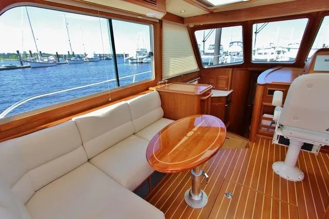  Yacht Photos Pics Interior of 2015 Sabre 42 Salon Express yacht with waterfront view.
