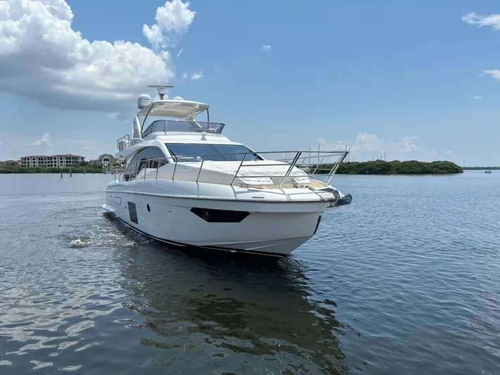 Kara Mia II Yacht Photos Pics 2019 Azimut 55 Motor Yacht cruising on a calm, scenic waterway.
