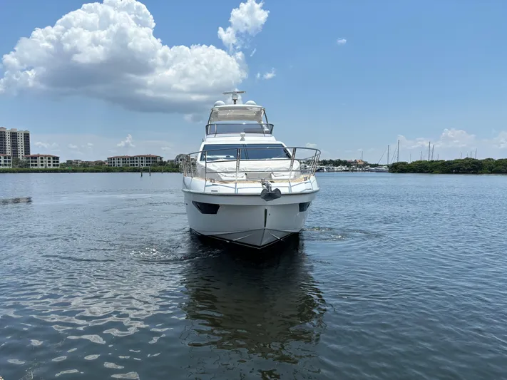 Kara Mia II Yacht Photos Pics Azimut 55 Motor Yacht 2019 cruising on calm waters under a partly cloudy sky.