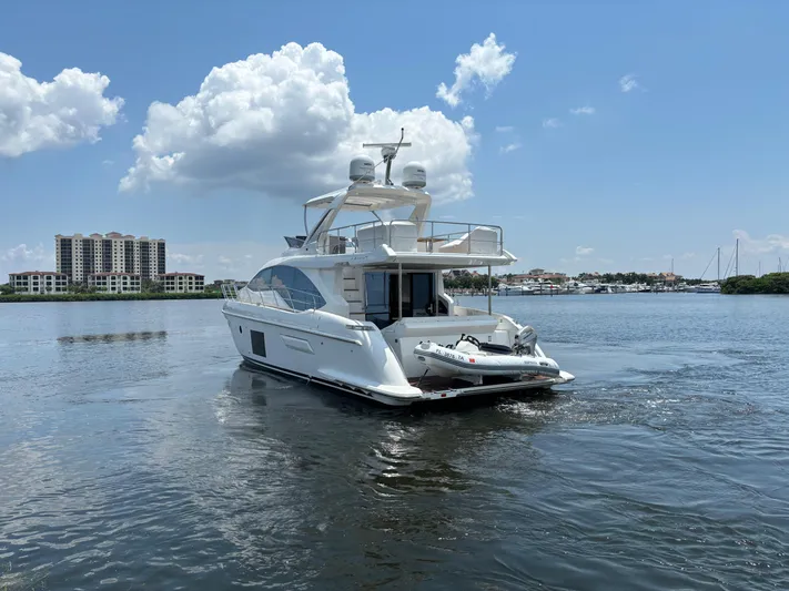 Kara Mia II Yacht Photos Pics Azimut 55 Motor Yacht 2019 cruising on a sunny day with scenic waterfront views.