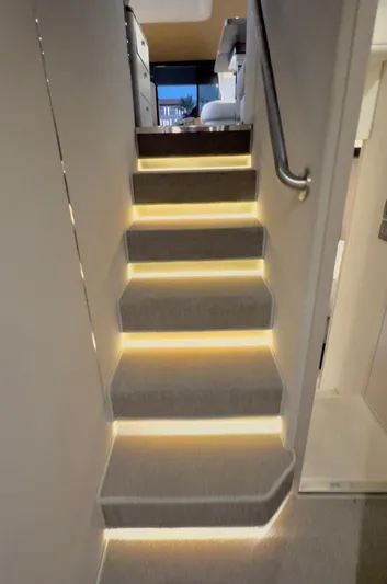 Kara Mia II Yacht Photos Pics Illuminated staircase inside 2019 Azimut 55 Motor Yacht, featuring modern design and ambient lighting.