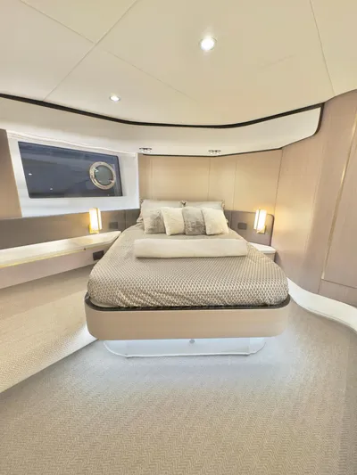 Kara Mia II Yacht Photos Pics Luxurious bedroom interior of 2019 Azimut 55 Motor Yacht with modern design and cozy bedding.