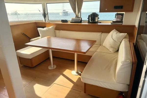 Nauti Adventure Yacht Photos Pics Luxurious interior of 2015 Lagoon 52 F yacht with cozy seating and ocean view.