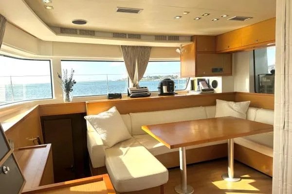 Nauti Adventure Yacht Photos Pics Interior of 2015 Lagoon 52 F yacht with cozy seating and ocean view.
