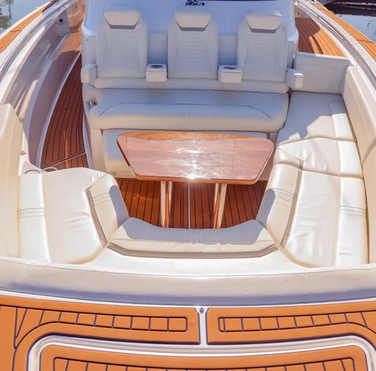Oso Del Mar Yacht Photos Pics Luxurious seating area on 2022 Tiara Yachts 43 LS with elegant wood accents.