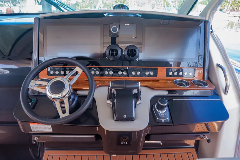 Oso Del Mar Yacht Photos Pics Helm of 2022 Tiara Yachts 43 LS with modern controls and displays.