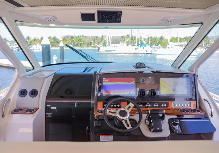 Oso Del Mar Yacht Photos Pics 2022 Tiara Yachts 43 LS helm with advanced navigation displays and controls.