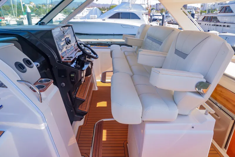 Oso Del Mar Yacht Photos Pics 2022 Tiara Yachts 43 LS helm with luxurious seating and modern controls.