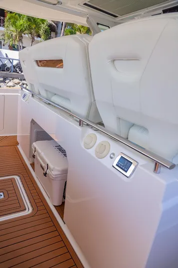 Oso Del Mar Yacht Photos Pics 2022 Tiara Yachts 43 LS interior with white seating and teak flooring.