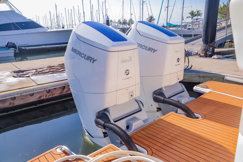 Oso Del Mar Yacht Photos Pics Twin Mercury outboard engines on a 2022 Tiara Yachts 43 LS at a marina.
