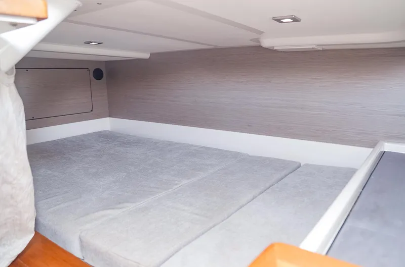 Oso Del Mar Yacht Photos Pics Interior cabin of 2022 Tiara Yachts 43 LS with modern design and comfortable bedding.