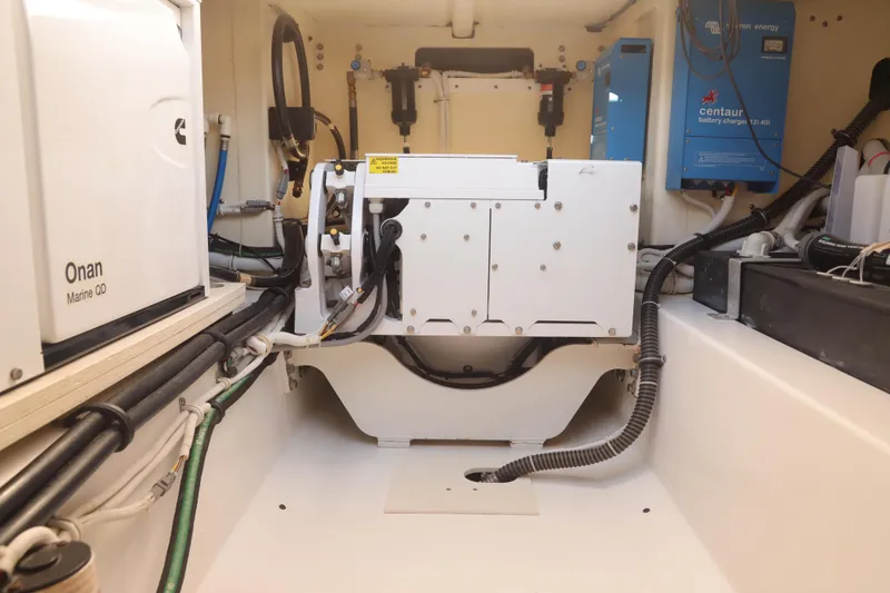 Oso Del Mar Yacht Photos Pics Engine room of 2022 Tiara Yachts 43 LS with Onan Marine QD generator and Centaur battery charger.