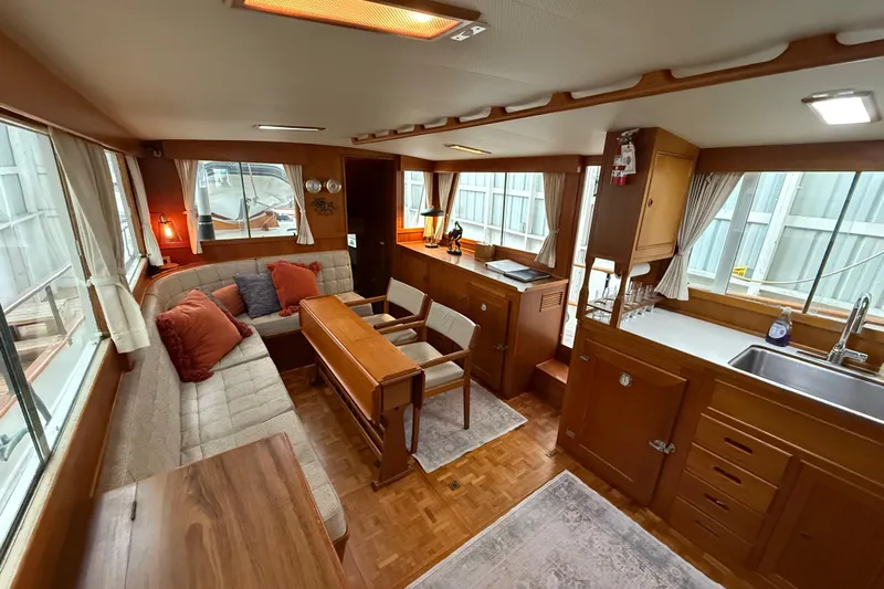  Yacht Photos Pics Interior of 1981 Grand Banks 42 Classic yacht with cozy seating and wooden cabinetry.