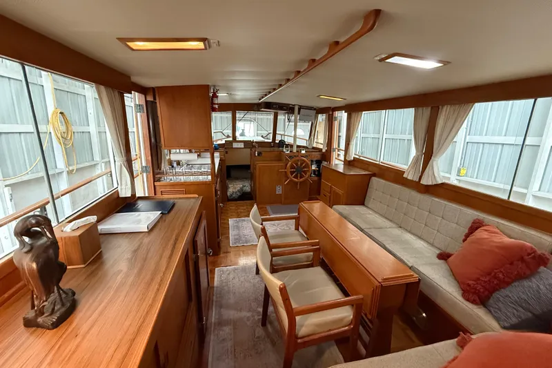  Yacht Photos Pics Interior of 1981 Grand Banks 42 Classic yacht with wooden furnishings and cozy seating.