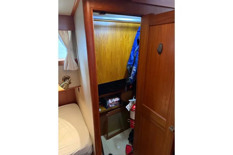  Yacht Photos Pics Interior of 1981 Grand Banks 42 Classic yacht with closet and fire extinguisher.