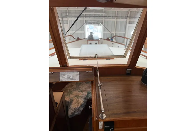  Yacht Photos Pics Interior view of 1981 Grand Banks 42 Classic yacht, showcasing wooden details and cabin area.