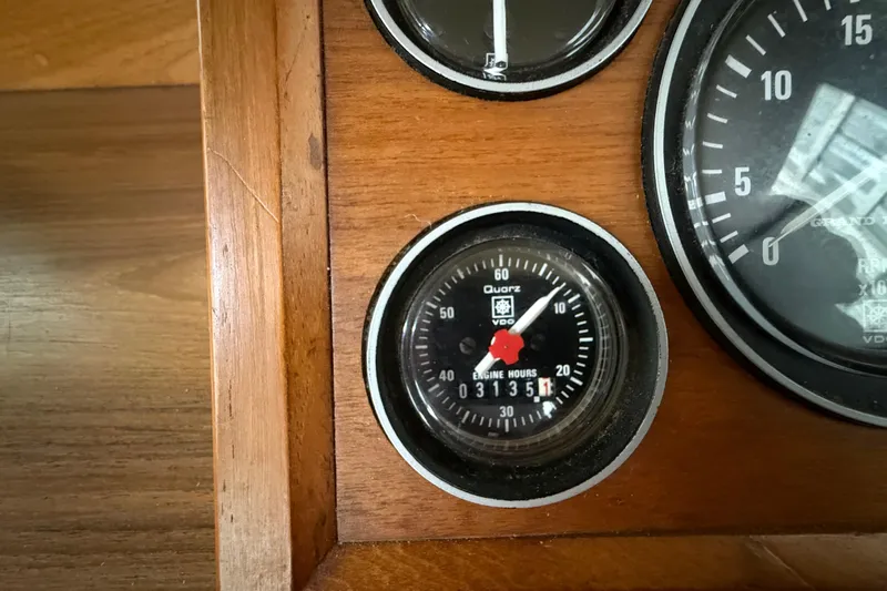  Yacht Photos Pics Close-up of 1981 Grand Banks 42 Classic engine hour meter on wooden dashboard.