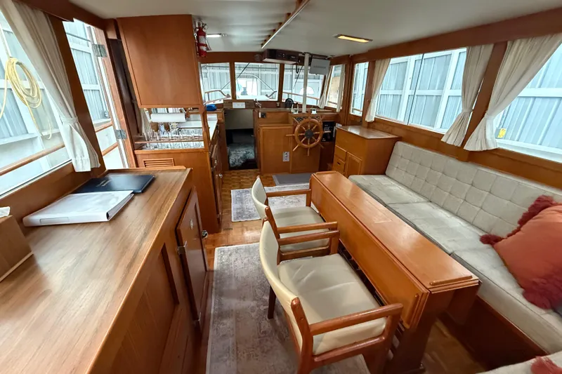  Yacht Photos Pics 1981 Grand Banks 42 Classic yacht interior with wooden furnishings and cozy seating area.